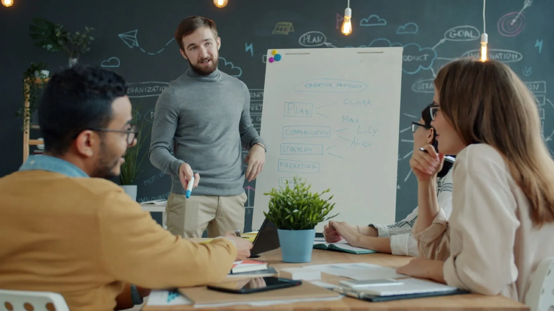 Facilitator leading an interactive training workshop at a whiteboard